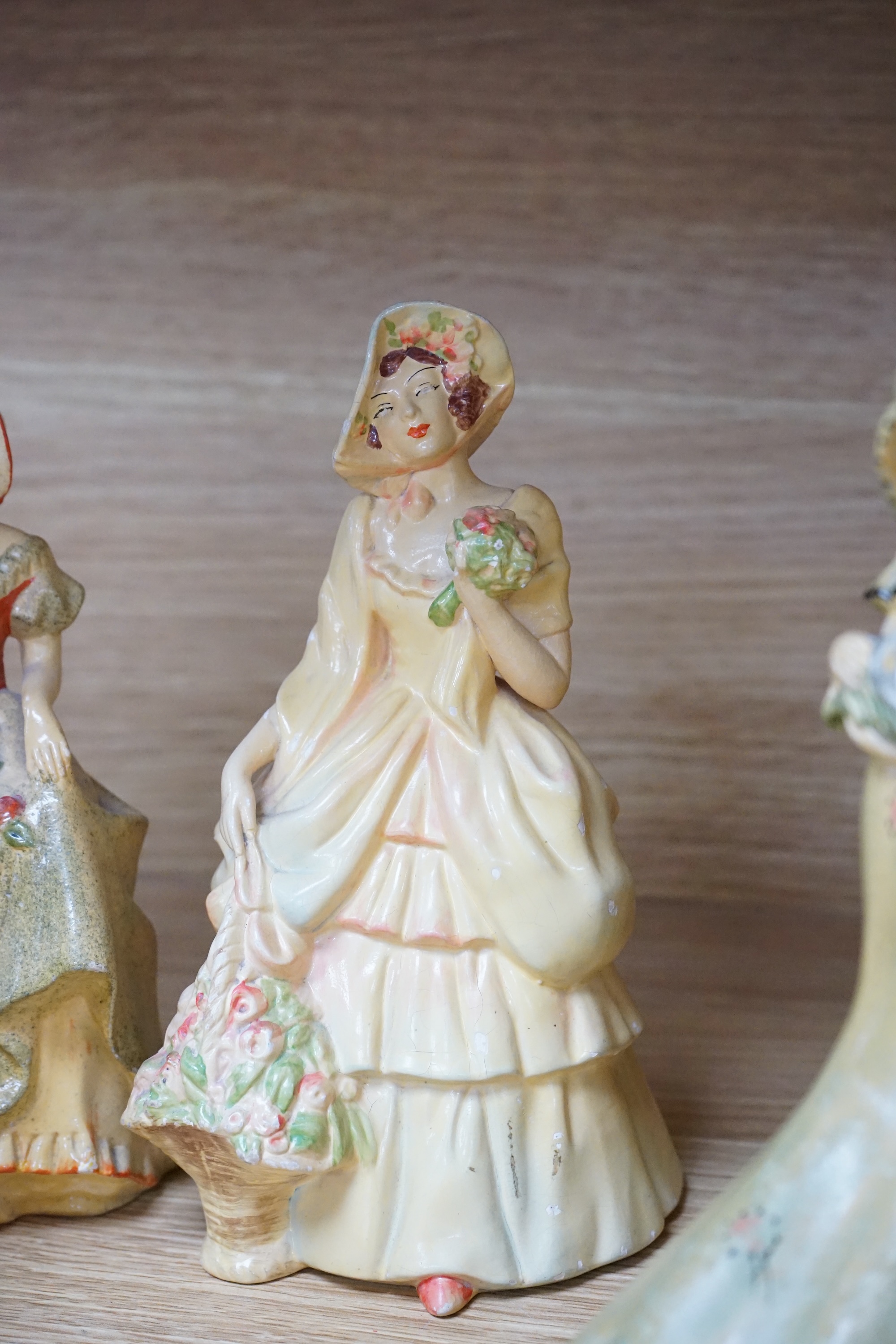 Nine Crown Devon 1930's dancers, in the manner of Wade figures, tallest 26cm high. Condition - fair to good